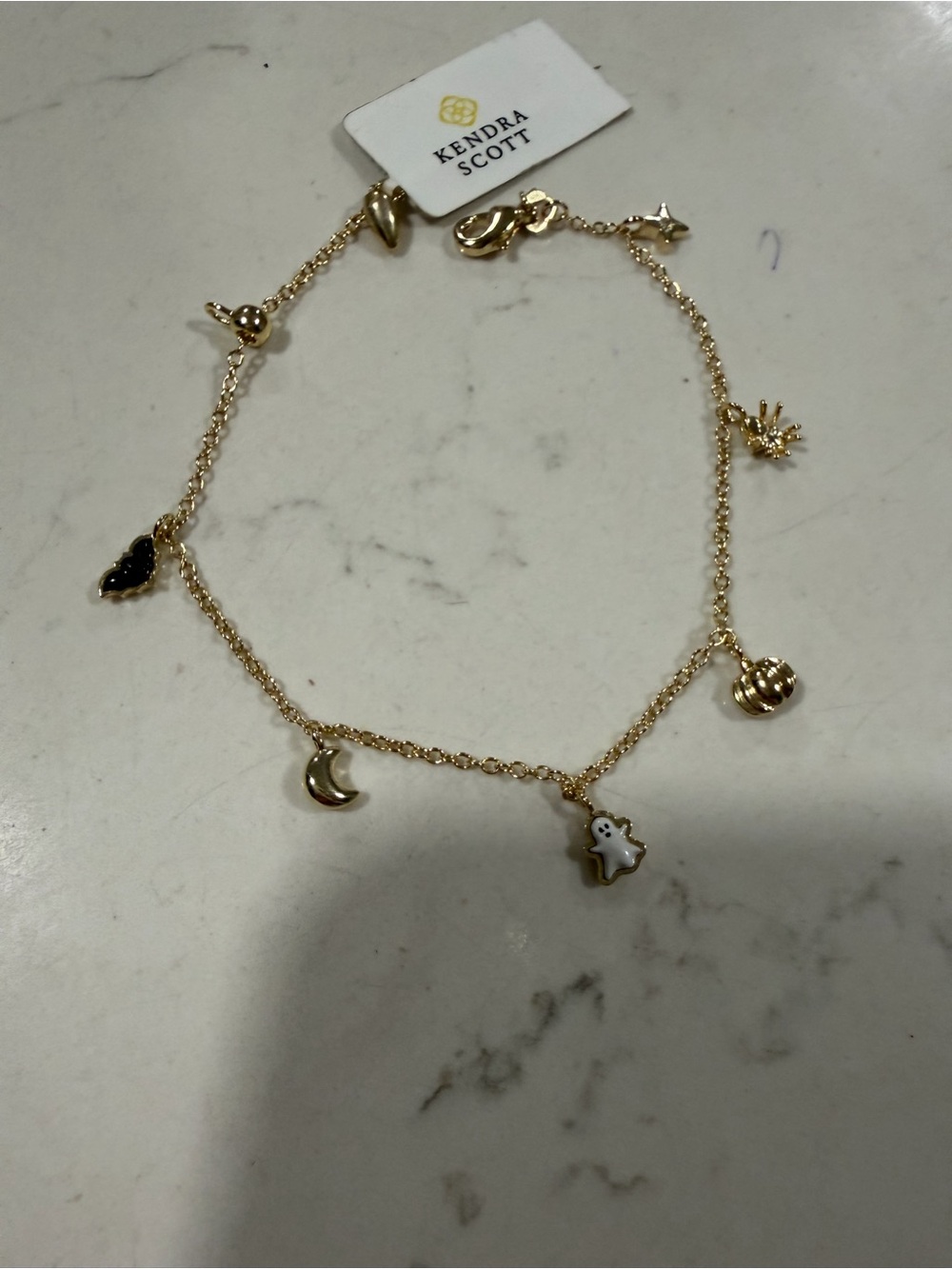 Kendra Scott Gold Charm Bracelet with Black and White Accents